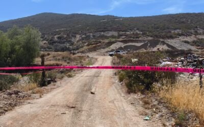 Localizan cadáver de menor en maleta abandonada en Tecate